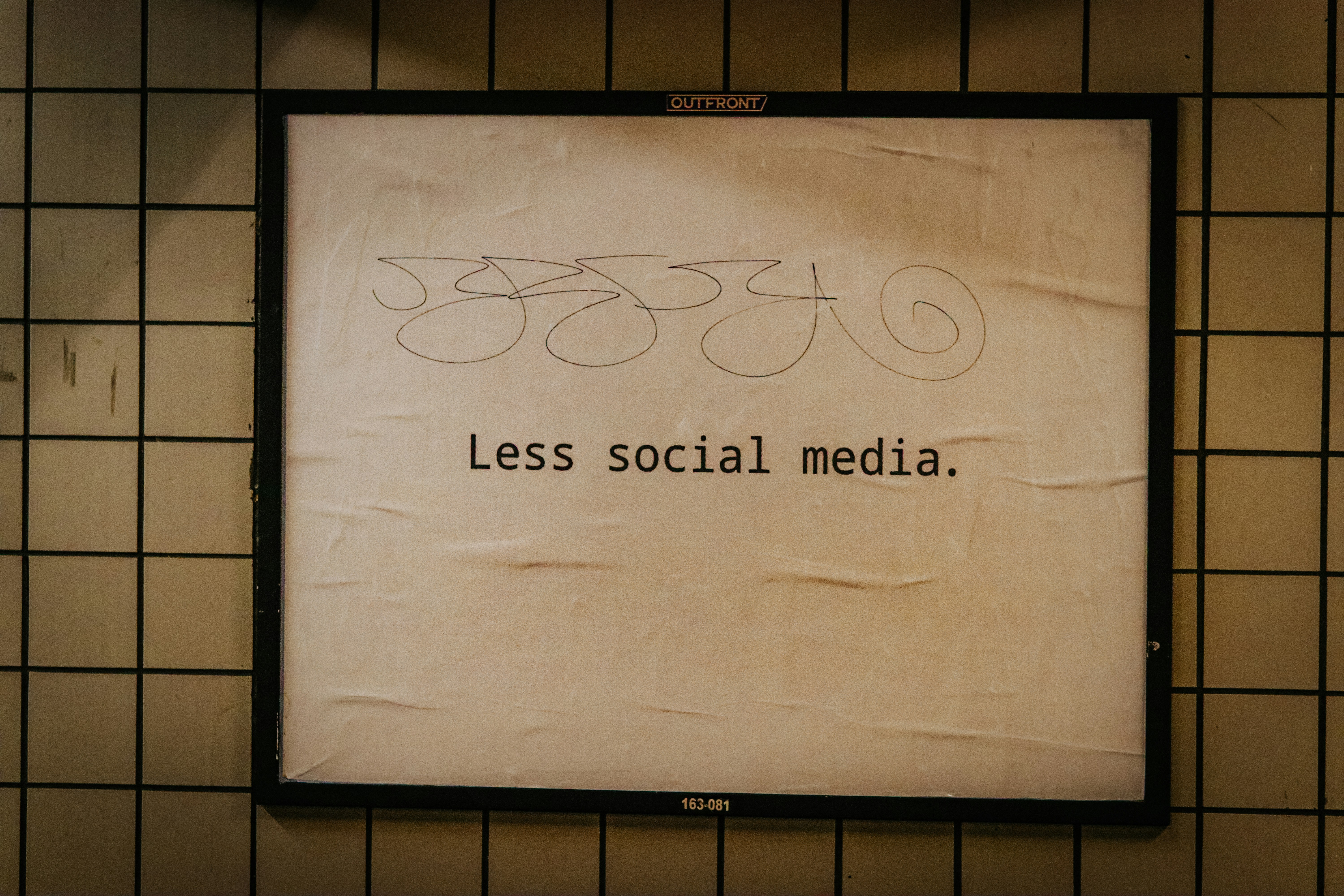 jon-tyson-less-social-media-sign