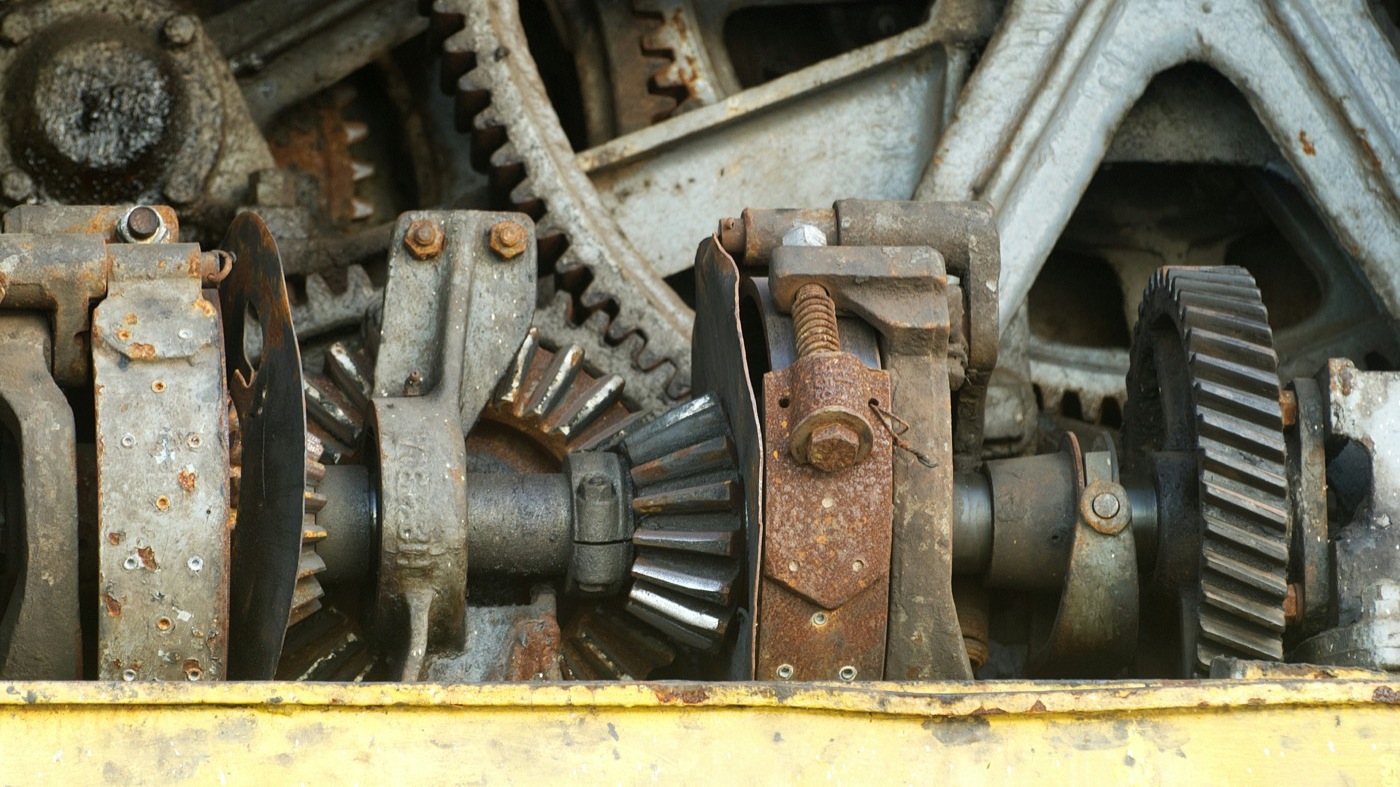 Close-up of rusty industrial gears and machinery